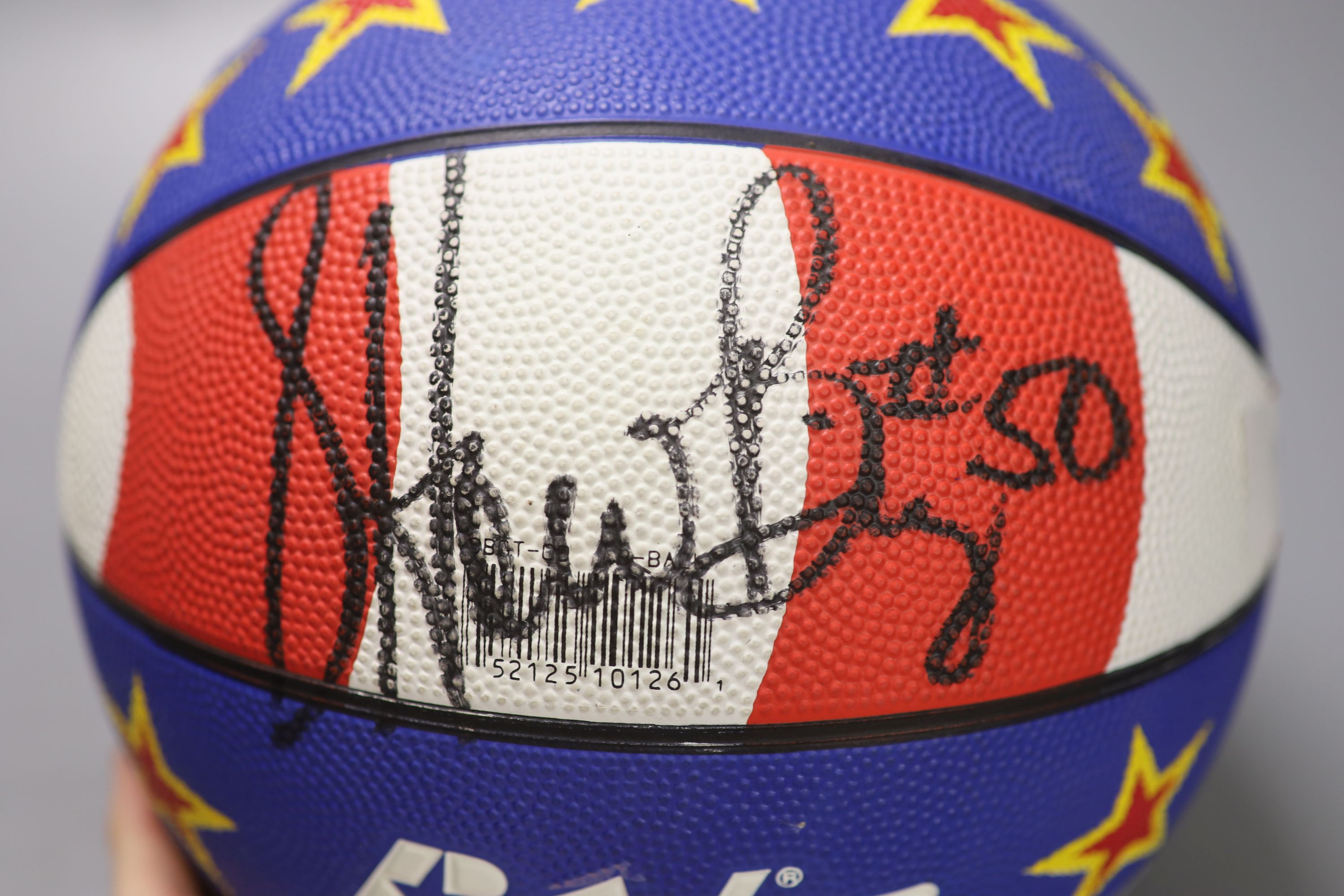 A Harlem Globe Trotters signed basketball